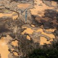 How does gold mining pollute the air?